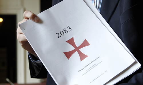 Belgium's Flemish right wing Vlaams Belang party member Veys poses with a part of the manifesto written by Anders Behring Breivik, at the Belgian Parliament in Brussels
