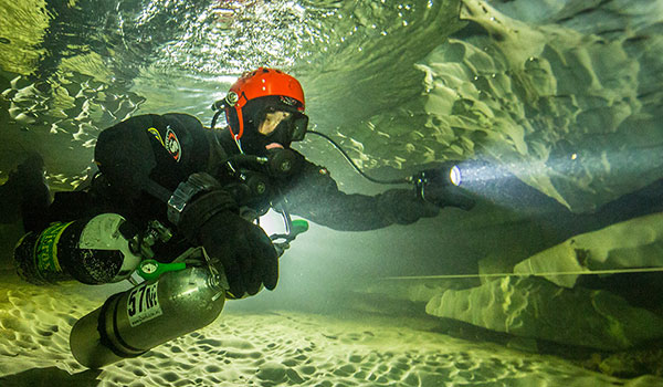 Dimitri: Since the caves most of the time are very narrov, the divers must hold their air cylinders by hand